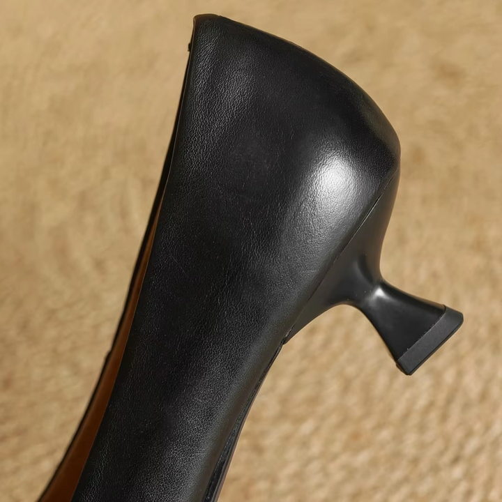 Sleek women's pointed-toe pumps with a slender thin heel, designed for elegant comfort.