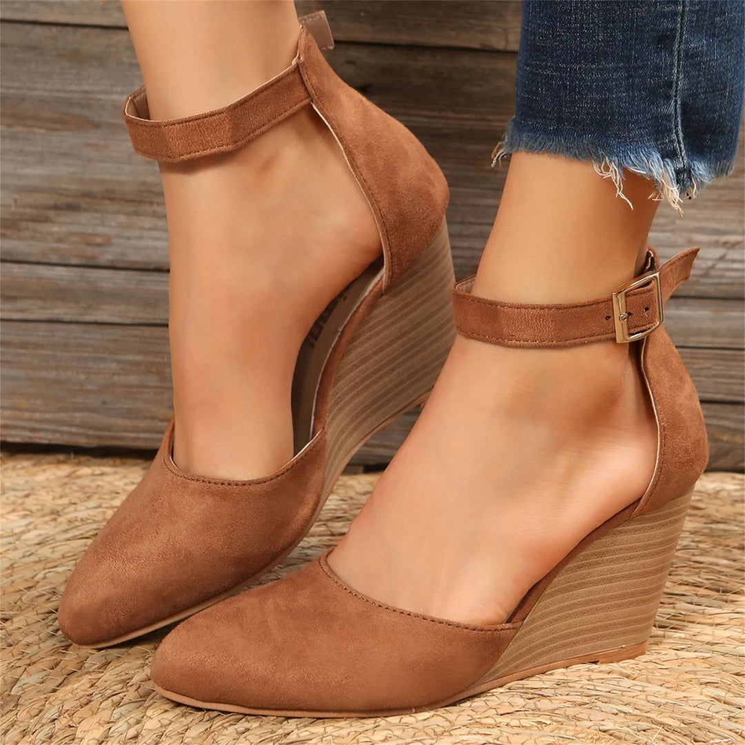 Classic modern women's wedge heels with an elegant pointed toe and stylish ankle strap for dressy or casual looks.