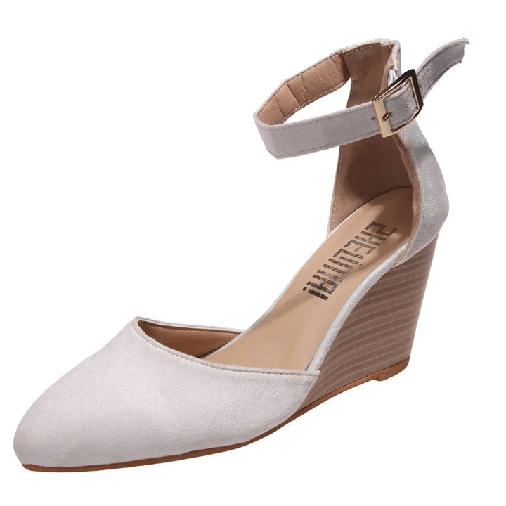 Versatile women's dress shoes: elegant pointed toe wedge heels with an ankle strap, ideal for casual chic.