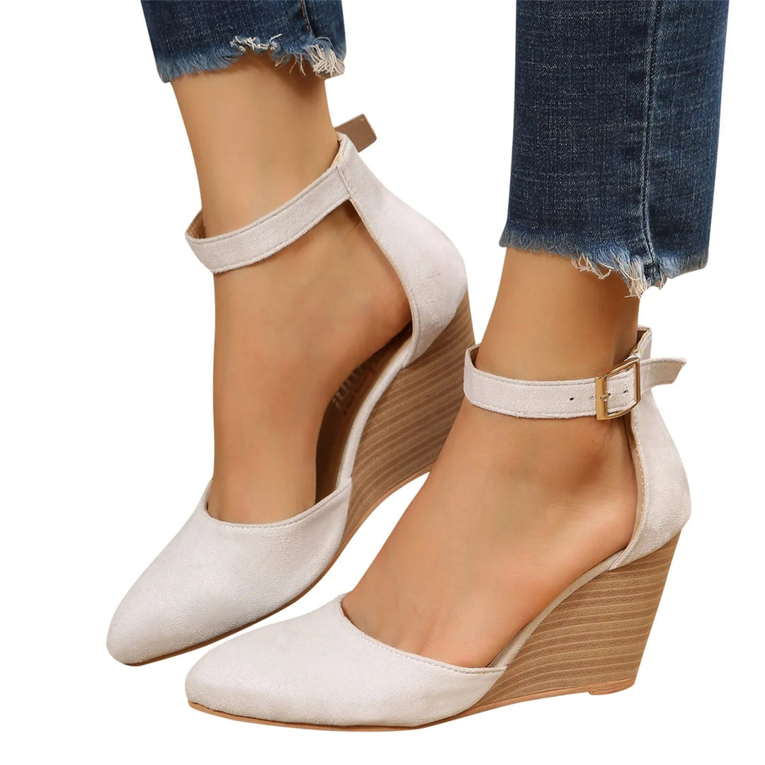 Women's elegant pointed toe wedge heels for a sophisticated look, featuring a comfortable and secure ankle strap.