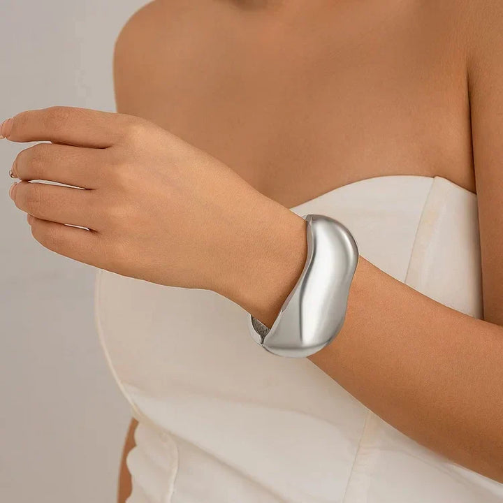 Elegant women's polished alloy cross bracelet with irregular modern design, versatile silver & gold mixed metal jewelry.
