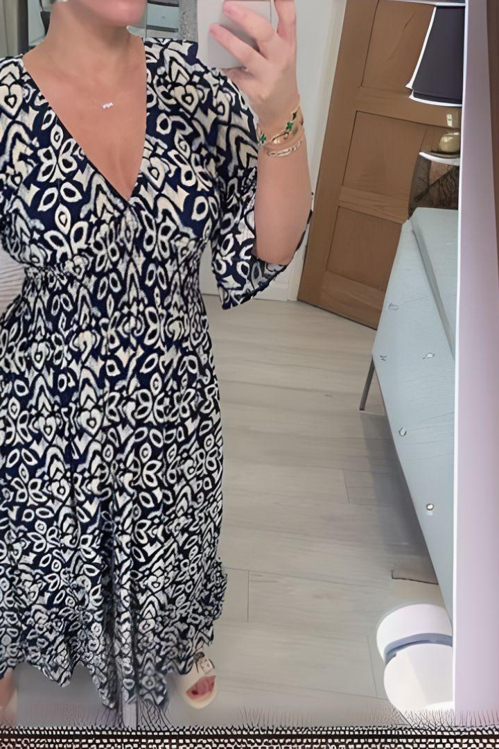 Women's printed spring midi dress. This elegant belted dress offers a flattering silhouette, suitable for various events.