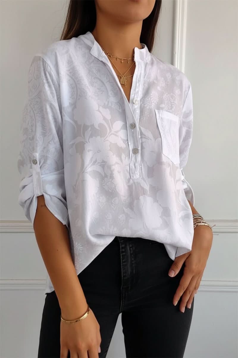 Versatile women's printed long sleeve blouse with a stylish front pocket, ideal for casual everyday wear.