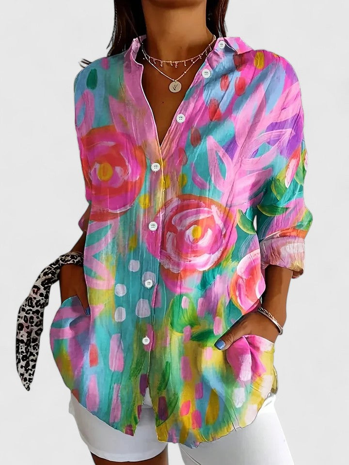 Elegant women's printed blouse with vibrant, sophisticated pattern. Versatile and chic ladies' fashion top.