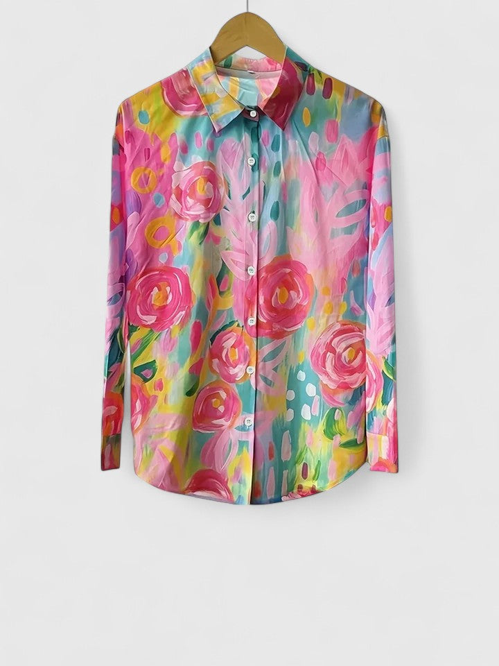 Sophisticated ladies' printed blouse featuring a colorful and vibrant design. Elegant women's fashion top.