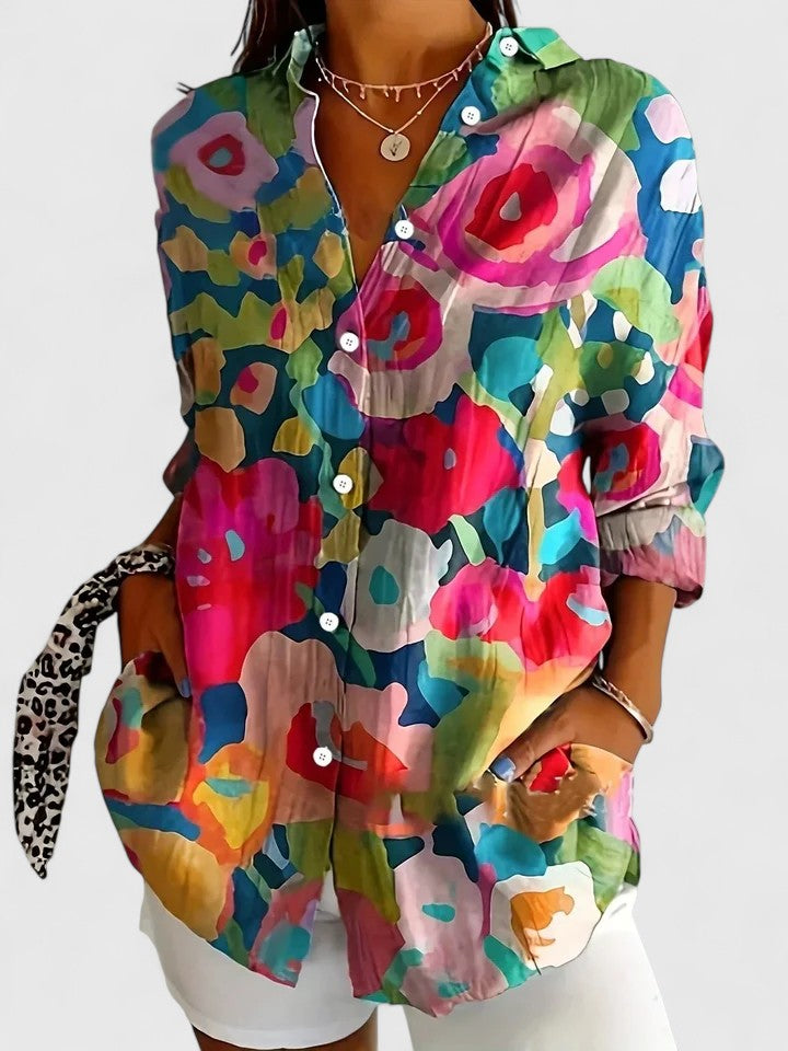 Vibrant women's printed blouse, a sophisticated and colorful fashion top for ladies. Elegant and comfortable.