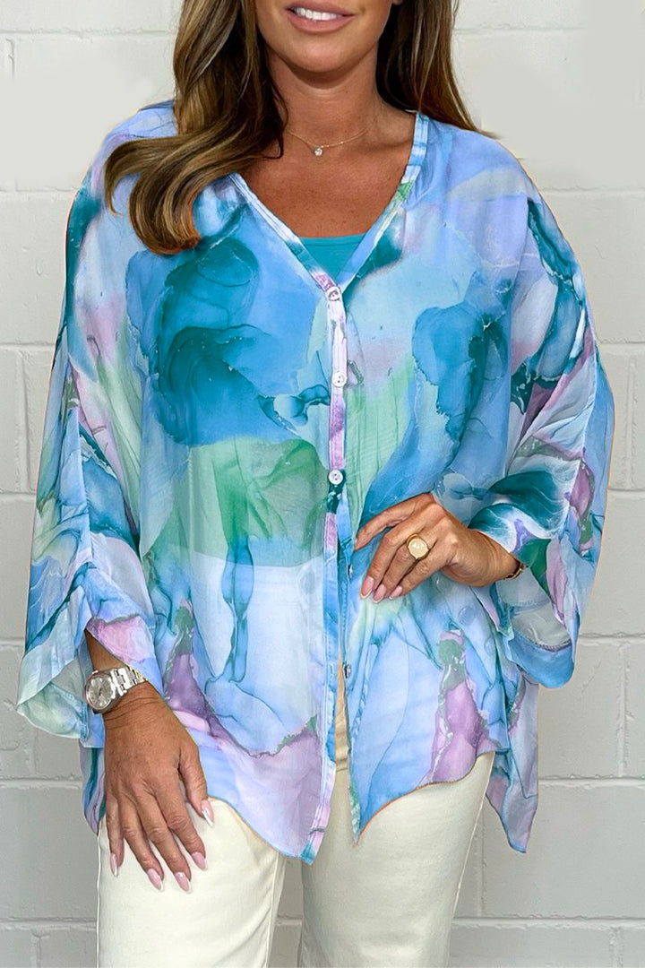 Women's sophisticated printed long sleeve blouse with a relaxed fit, ideal for elegant casual spring outfits.