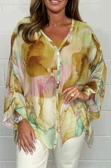 Women's elegant printed long sleeve top, a chic relaxed fit blouse for fashionable spring and summer wear.