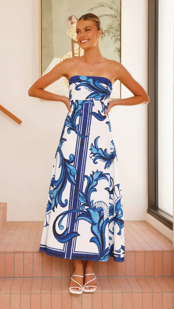 Elegant women's printed maxi dress with flowy short sleeves, perfect for summer weddings or occasions.