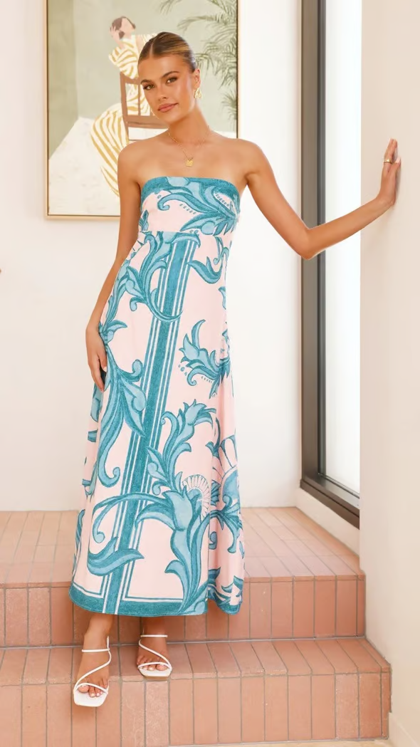 Women's occasion maxi dress with vibrant print & flowy short sleeves, offering elegant, comfortable wear.