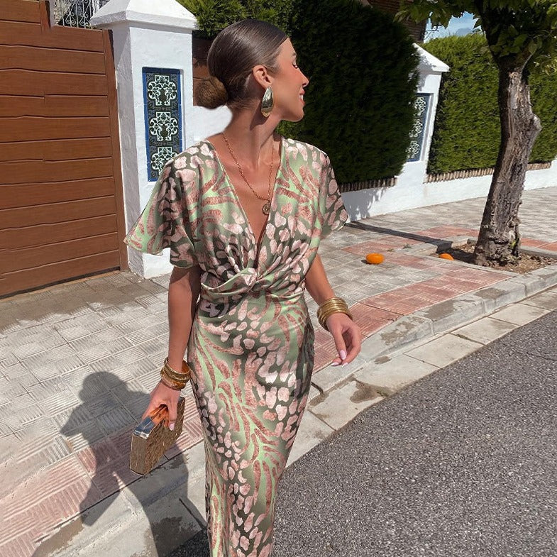 Chic printed maxi dress for women, featuring a flattering twist-front and V-neck, ideal for special occasion or cocktail.