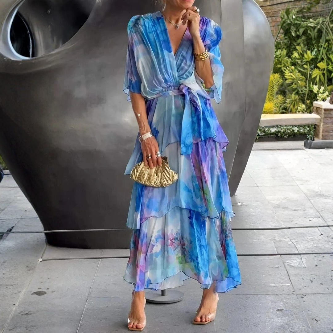 Stylish women's printed tiered wrap dress with long sleeves. Perfect for summer galas or wedding guest attire.