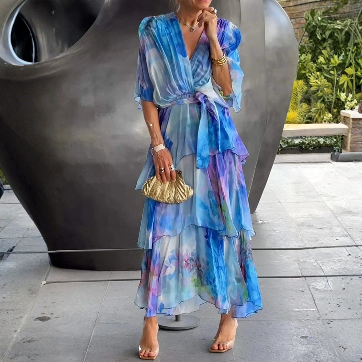 Stylish women's printed tiered wrap dress with long sleeves. Perfect for summer galas or wedding guest attire.