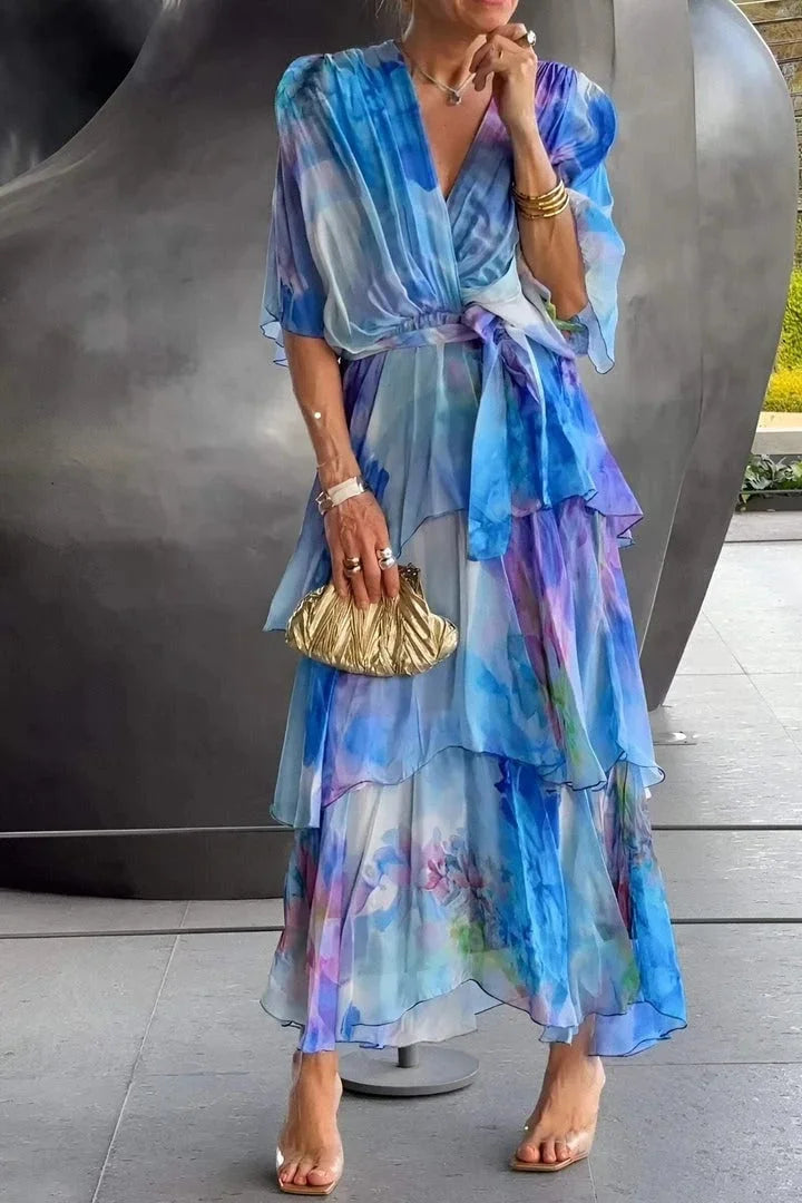 Chic formal long sleeve wrap dress for women. Features elegant print & tiered skirt, ideal for evening events.