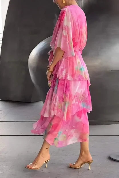 Gorgeous women's printed wrap dress with flowing tiered skirt & long sleeves. Perfect formal or special occasion wear.