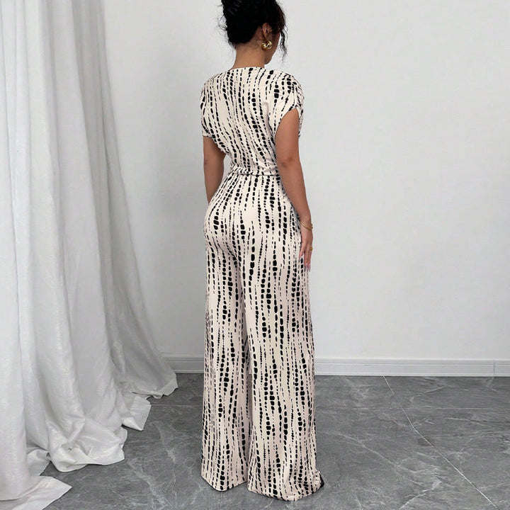 Chic women's one-shoulder printed wide-leg jumpsuit, a modern and elegant statement piece for special occasions.
