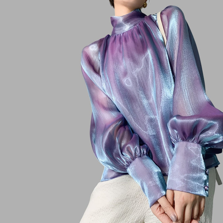 Elegant women's puff sleeve blouse. Stylish, versatile top for casual or workwear fashion.