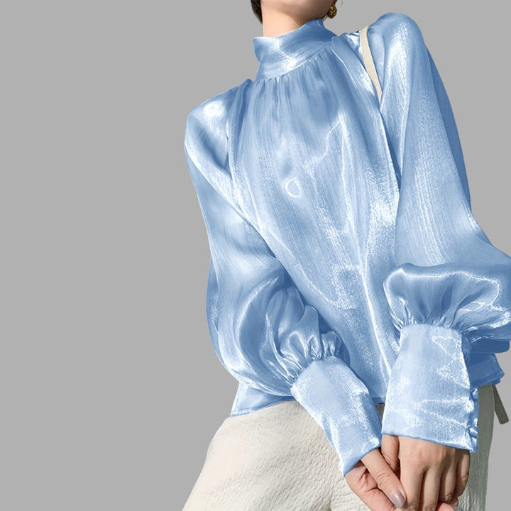Stylish women's puff sleeve blouse. Elegant and versatile long sleeve top for feminine fashion.