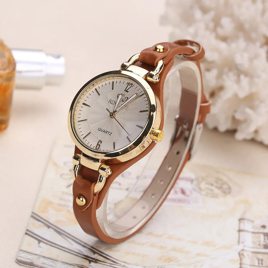 Elegant women's quartz watch with a sleek rose gold case and a stylish brown vegan leather strap.