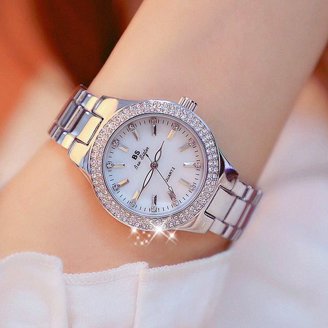 Elegant women's quartz watch with crystal details and mother-of-pearl dial, two-tone band, Aveline model.