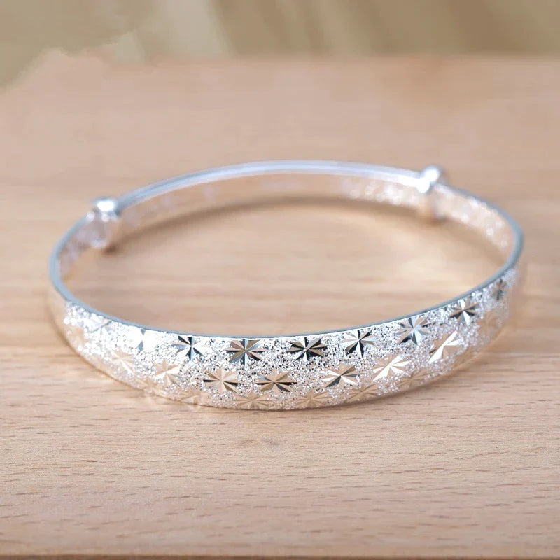 Celestial star design sterling silver armband bracelet for women, an elegant and adjustable jewelry gift for her.