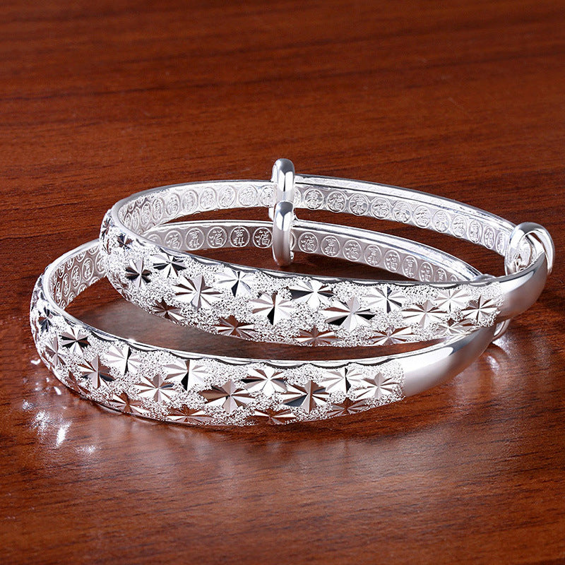 Gift for her: Elegant Women's Radiant Star Armband Bracelet, sterling silver with an adjustable celestial star.