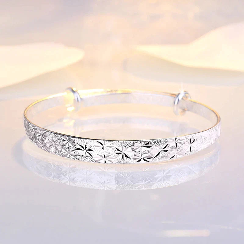 Radiant Star sterling silver armband bracelet for women. Elegant, adjustable celestial jewelry, perfect for gifting.