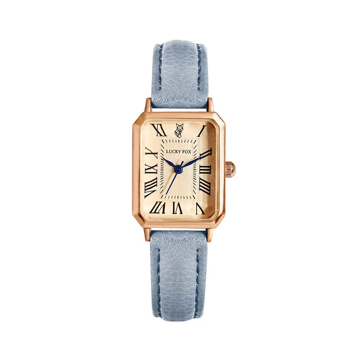 Women's elegant rectangle quartz watch comfortably worn on a wrist, showcasing its leather strap.