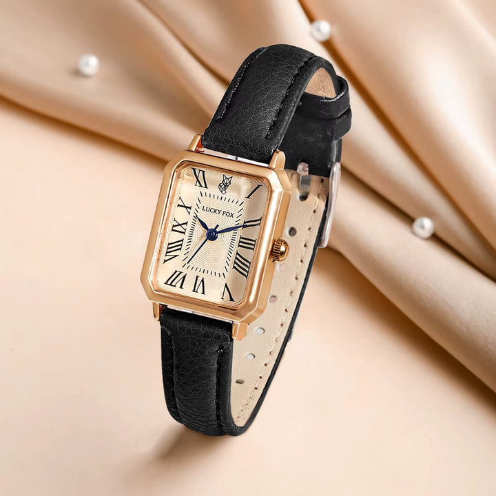Accurate women's rectangle quartz watch, elegant and reliable with a black leather band.