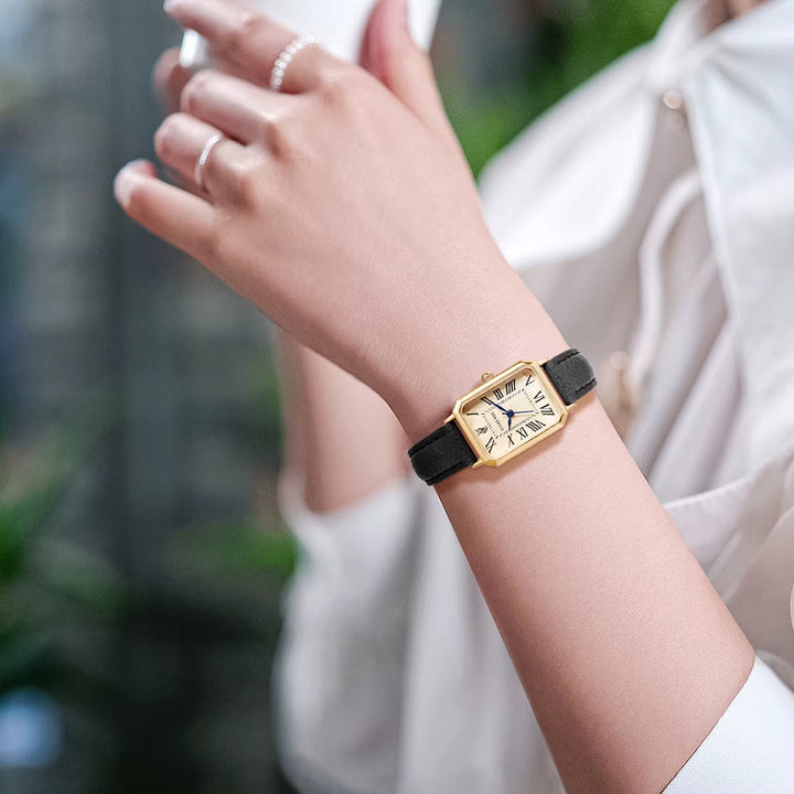 Fashionable women's dress watch, rectangle dial with a stylish leather strap for business or events.