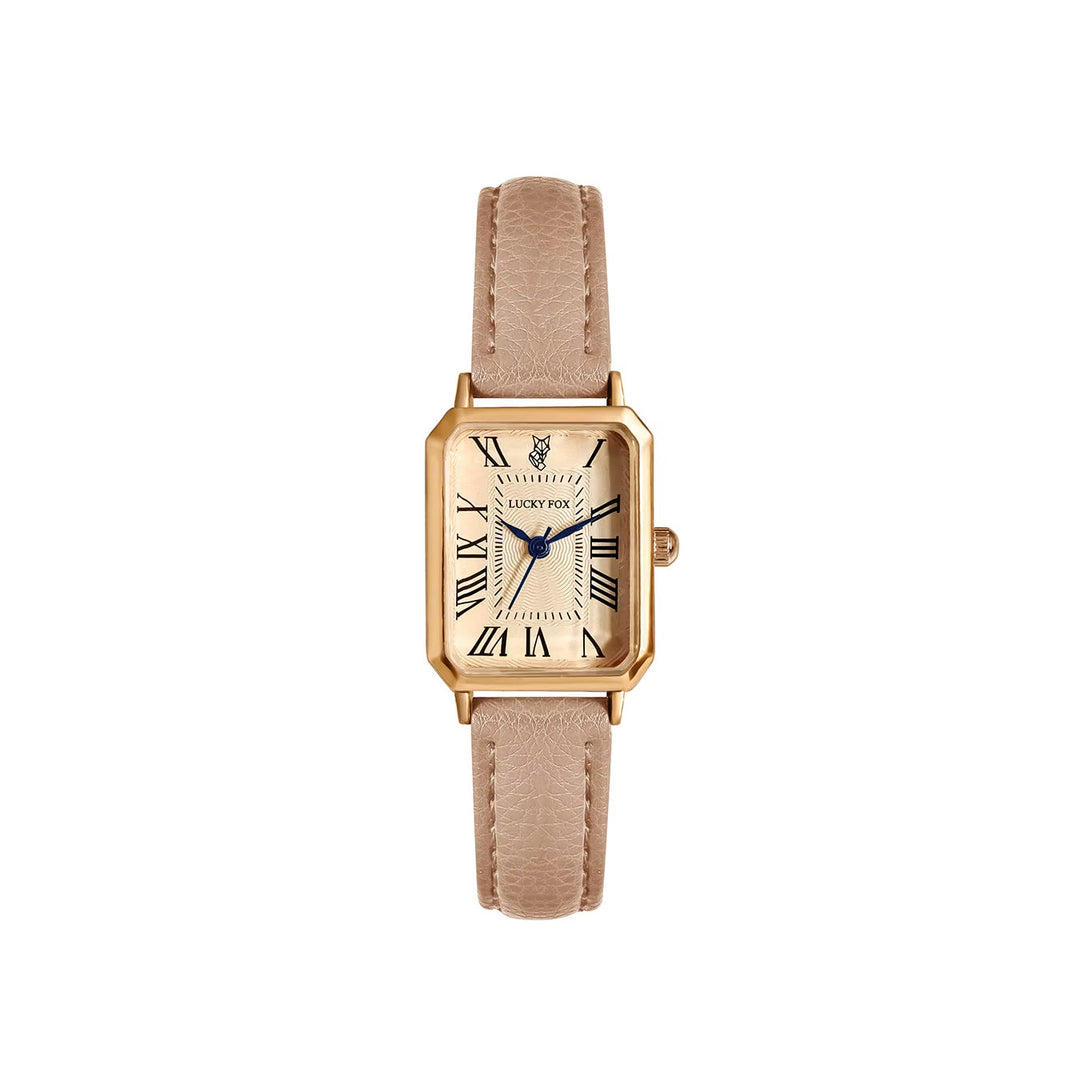 Detailed view of an elegant women's rectangle quartz watch face and its fine leather strap.