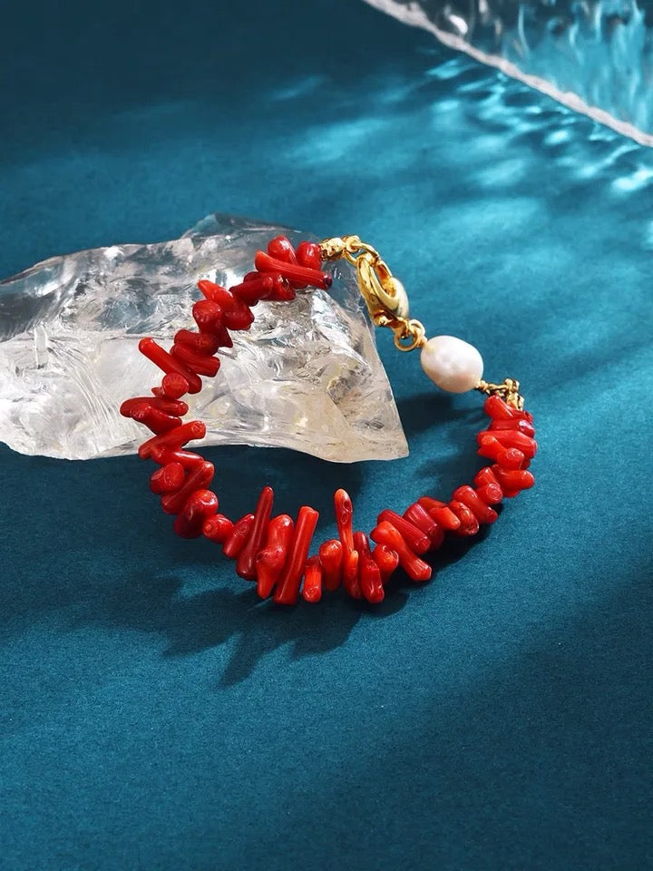 Elegant women's red coral bead bracelet, handcrafted with natural gemstones, a timeless fashion accessory.