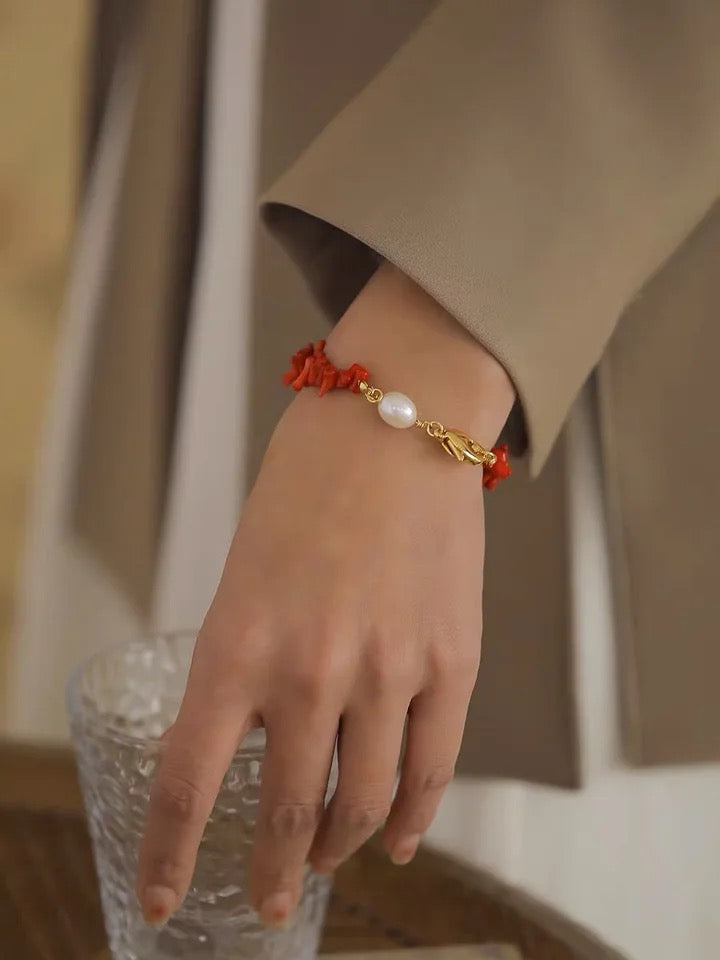 Adjustable women's red coral beaded bracelet, natural stone fashion accessory perfect for elegant everyday wear.