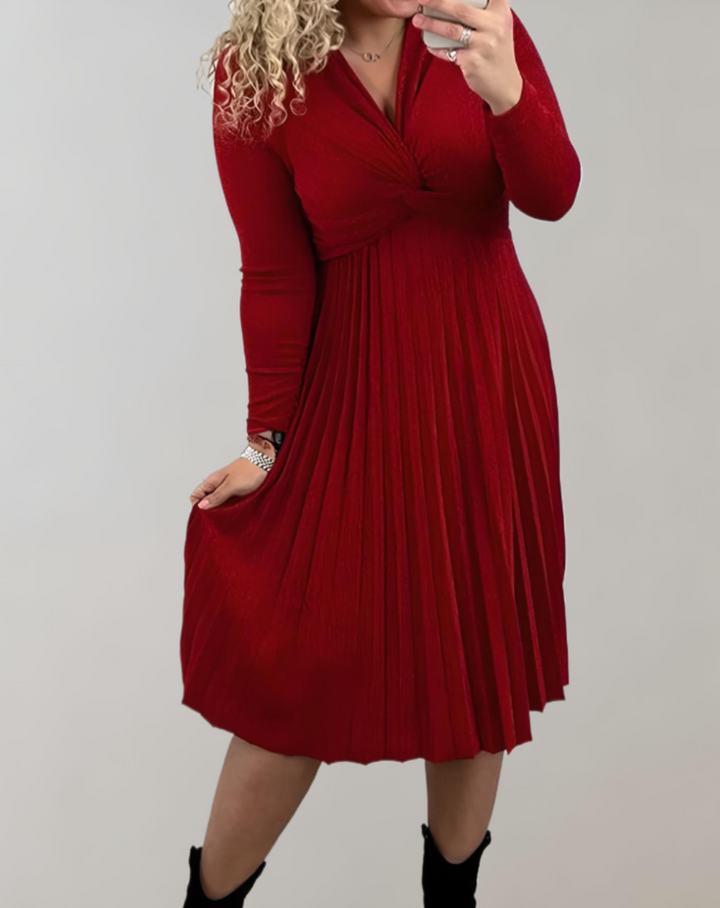 Women's pleated red midi dress with high waist, elegant V-neckline & long sleeves, perfect for sophisticated style.
