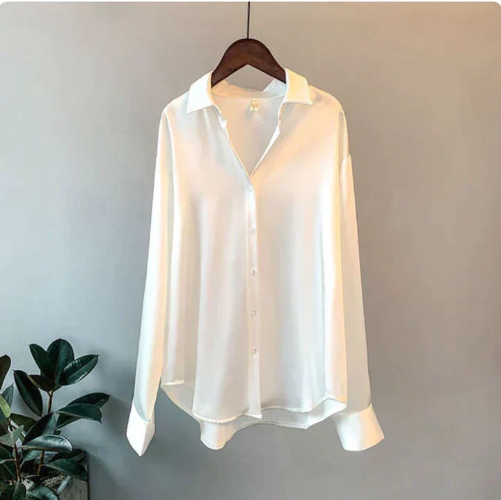 Chic women's button-up blouse, long sleeve and relaxed fit, offering sophisticated style for work or dressy occasions.