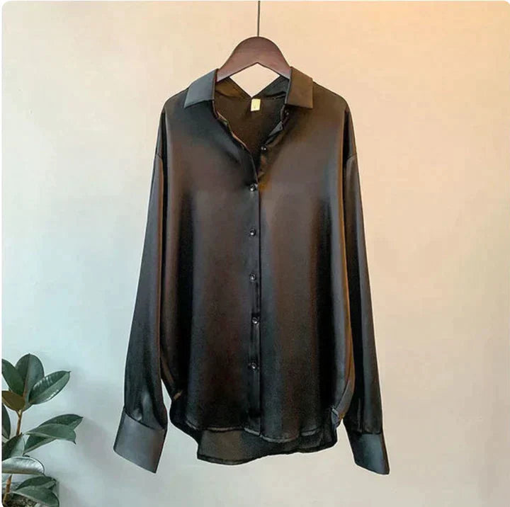 Sophisticated women's elegant blouse, relaxed and flowy, ensuring effortless style for any dressy or office setting.