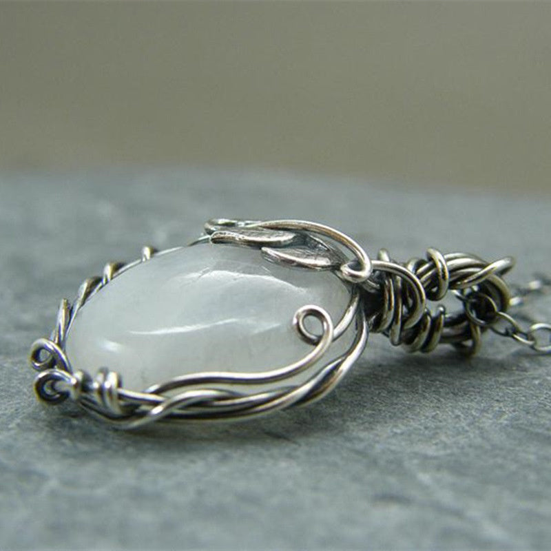 Close-up of a captivating retro moonstone pendant necklace, perfect vintage gemstone jewelry for women.