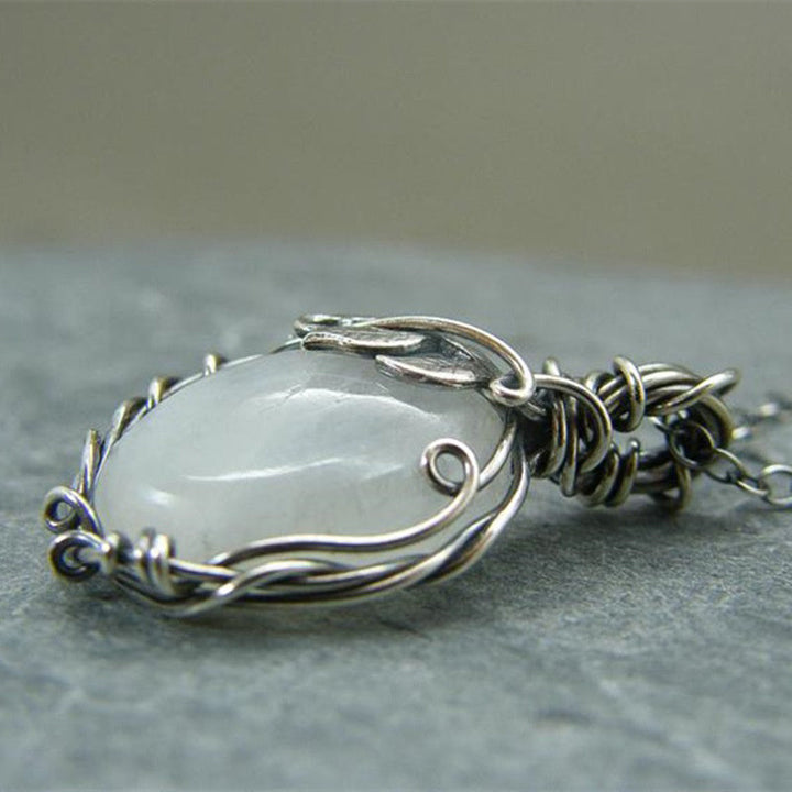 Close-up of a captivating retro moonstone pendant necklace, perfect vintage gemstone jewelry for women.