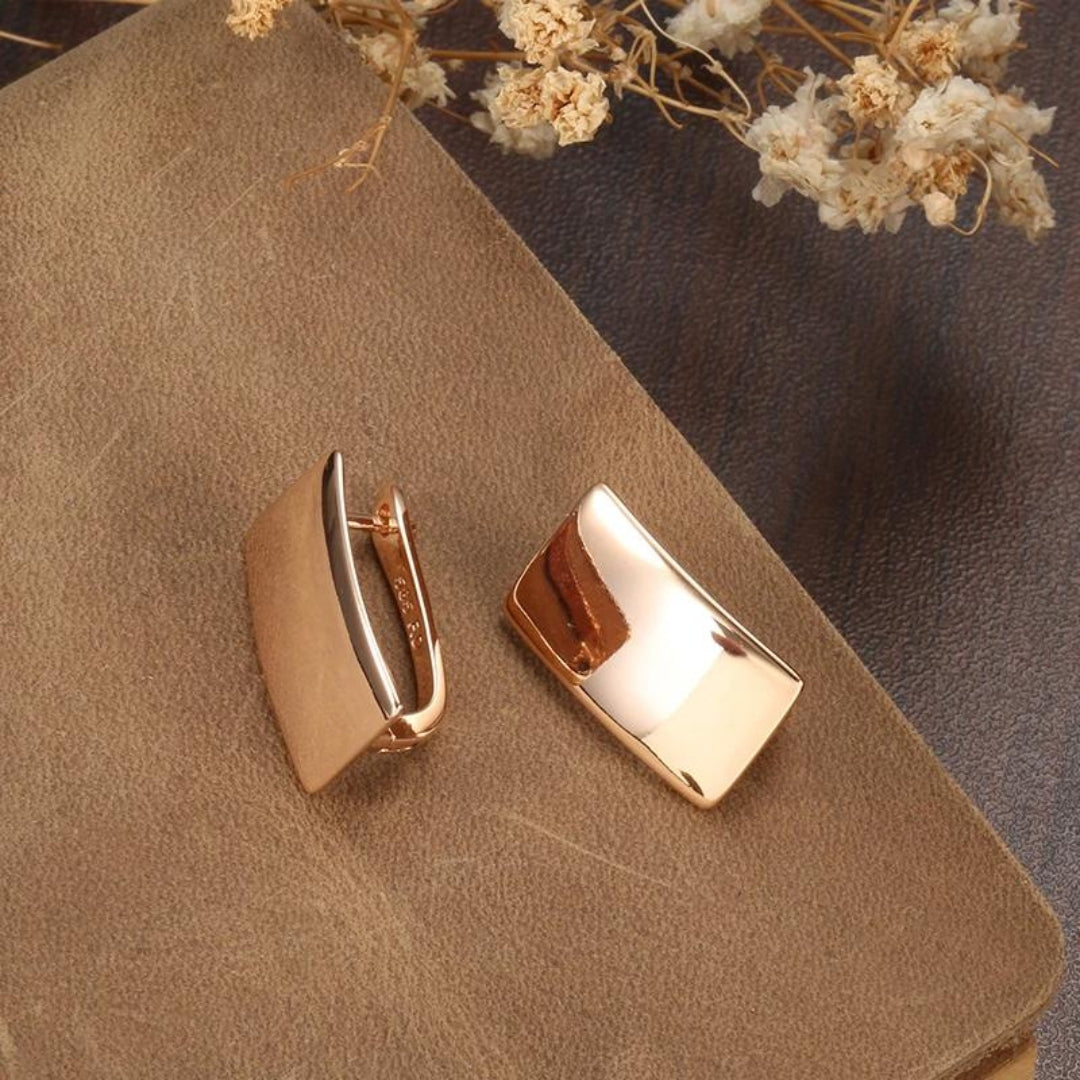 Elegant women's rose gold plated sterling silver minimalist stud earrings, perfect for everyday wear or a thoughtful gift.
