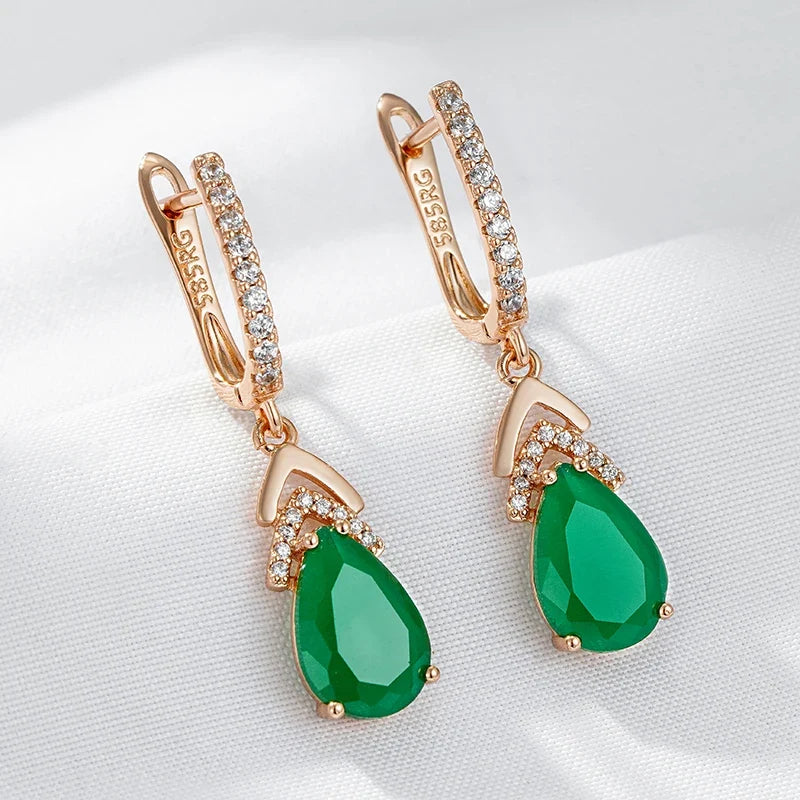 Elegant women's rose gold teardrop gemstone dangle earrings, sparkling for special occasions.