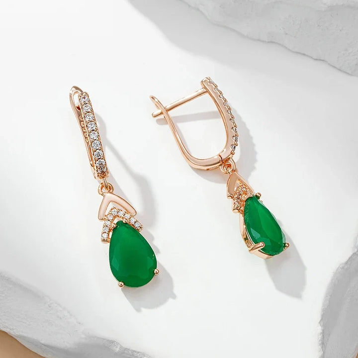 Women's shimmering rose gold teardrop gemstone dangle earrings, ideal for elegant special occasions.