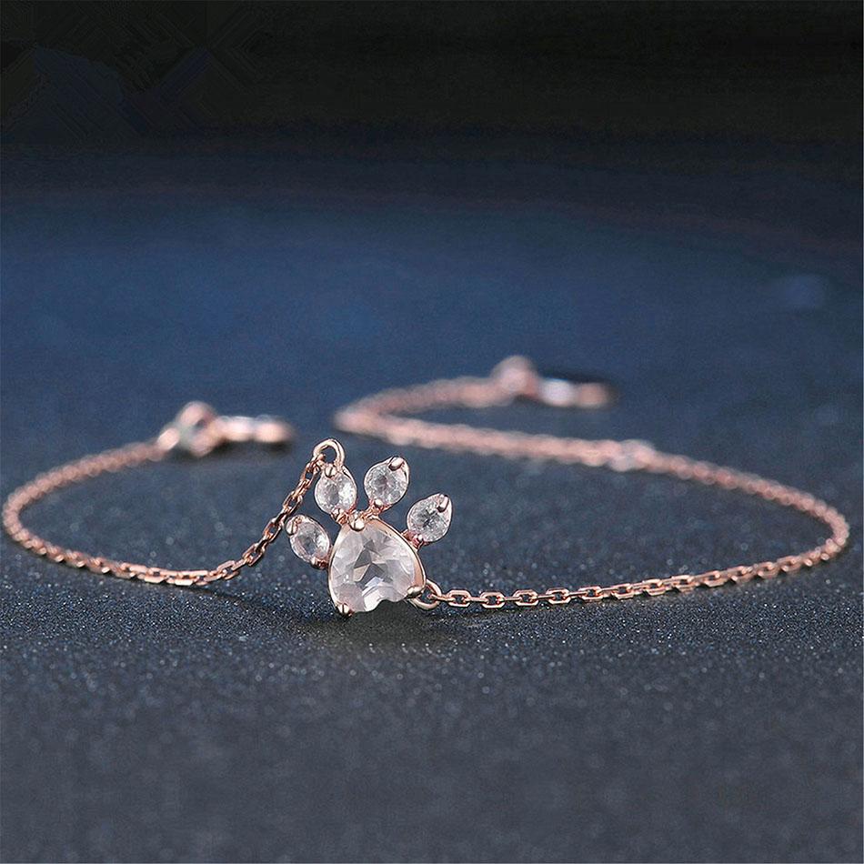Elegant women's rose quartz bracelet with delicate cat paw charm. Adjustable rose gold-tone jewelry, perfect for cat lovers.