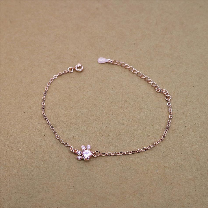 Pink rose quartz gemstone bracelet with a cute cat paw design. Adjustable women's jewelry, ideal gift for cat lovers.