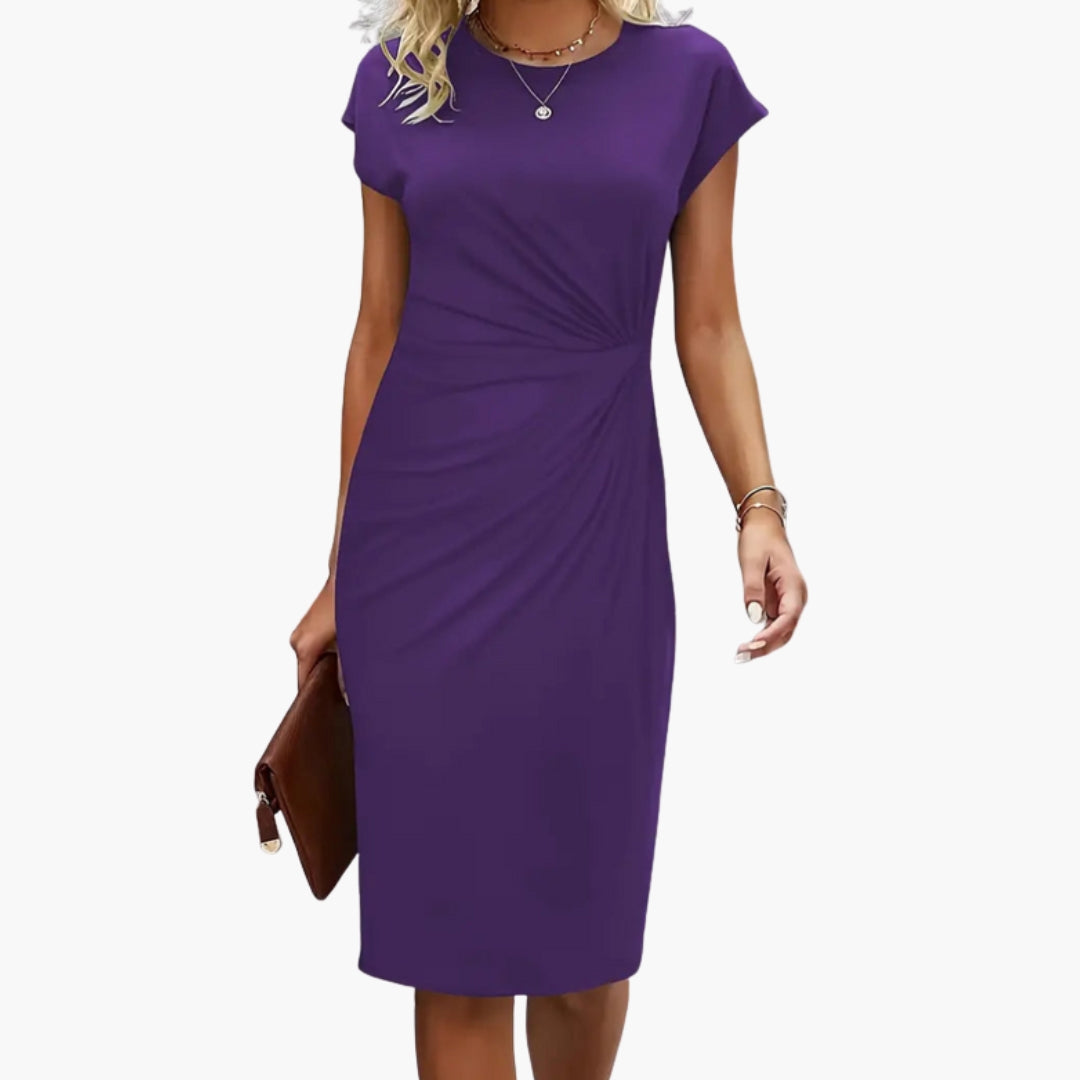 Elegant women's midi dress showcasing a flattering silhouette with a round neck and short sleeves.