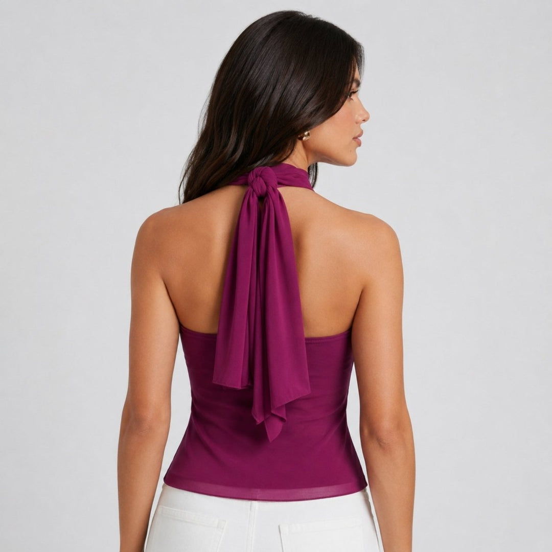 Chic women's sleeveless halter blouse with delicate ruffles, ideal for evening wear.
