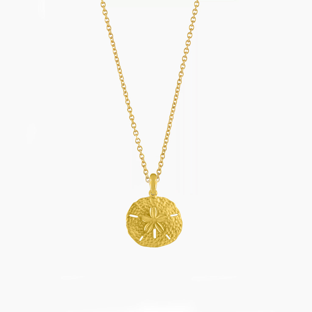 Elegant women's sand dollar pendant necklace, delicate coastal-themed ocean jewelry for any occasion.