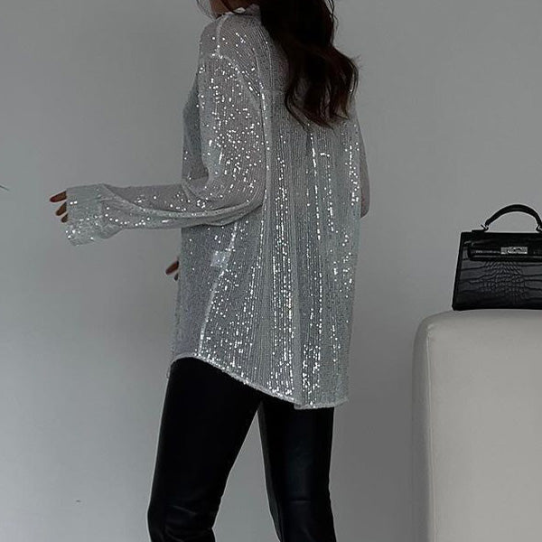 Comfortable loose sequin top for women, ideal for chic party outfits & special occasion sparkle. Fashionable.