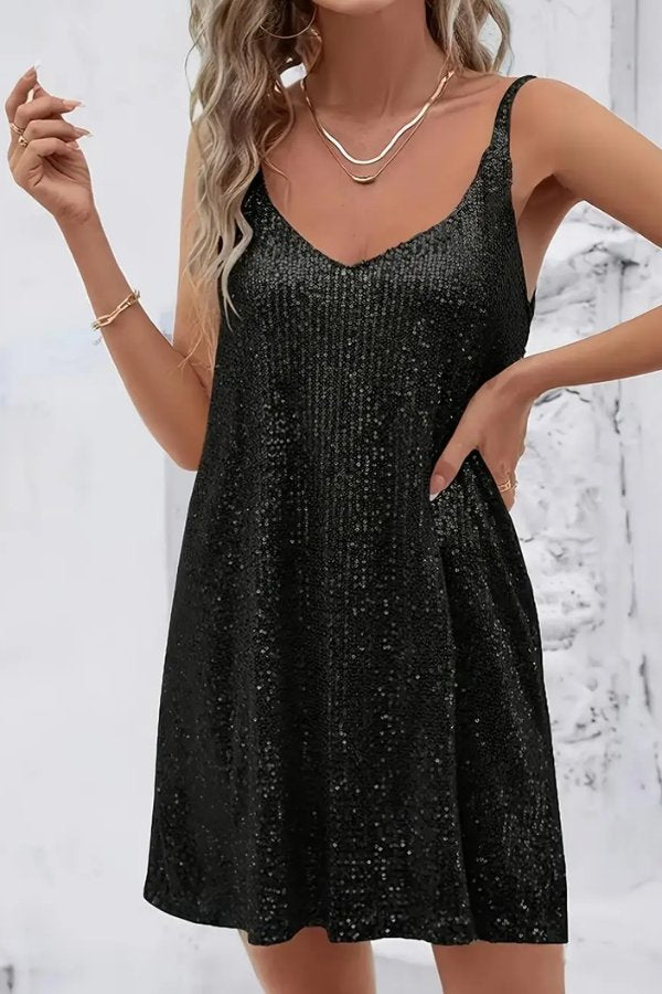 Shiny sequin mini dress for a women's night out. Elegant, short party wear with a glamorous feel.