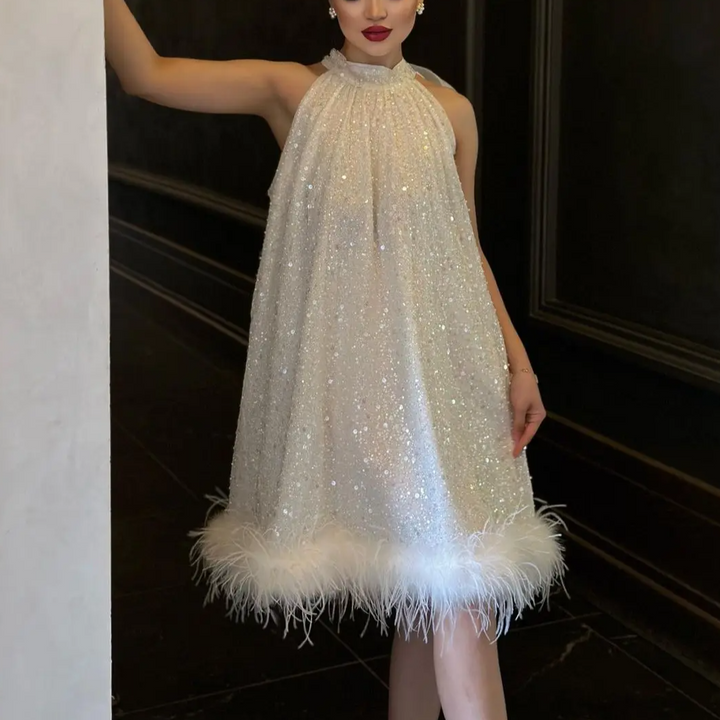 Elegant women's shimmering sequined feather evening dress, perfect for glamorous parties & special occasions.