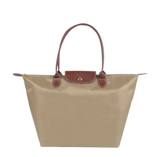 Stylish women's everyday shoulder bag, convertible to crossbody. Elegant nylon handbag for versatile use.